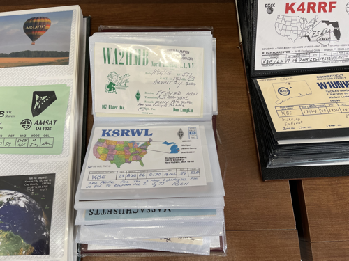A book of QSL cards sent to the lighthouse.