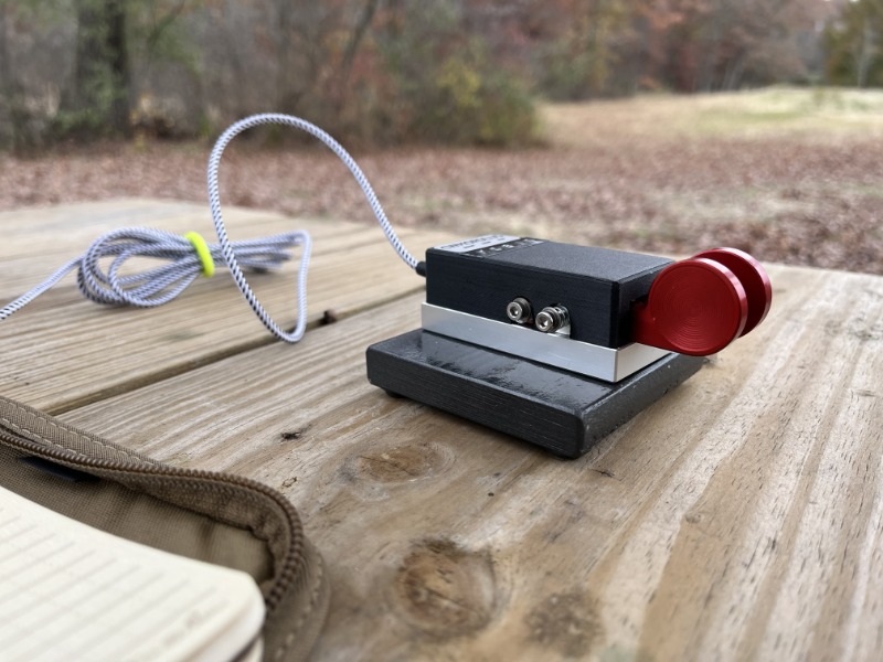 CW Morse paddles on a metal base.
