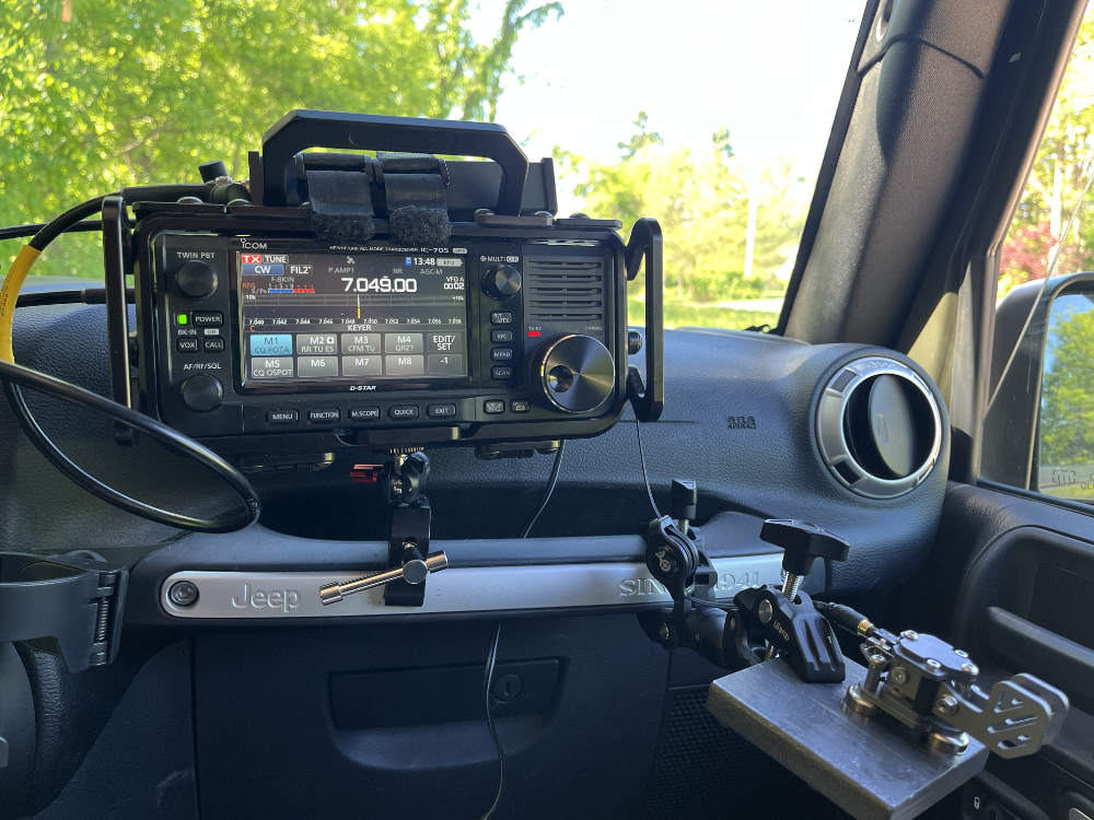 IC-705 and paddles on clamps that attach to the grab bar in front of the passenger's seat of the Jeep.