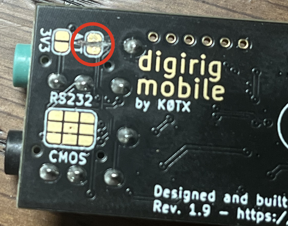 A close-up of the Digirig Mobile board with a brutally cut trace between the two solder pads labeled ATT.