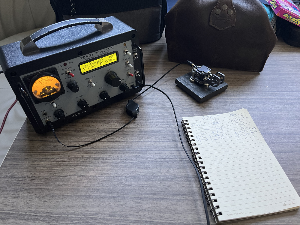 The TR-45L next to Putikeeg paddles and a logbook on a table in the camper.