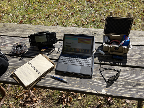 My notebook, IC-705, Surface Go 2, and Pelican Case O' Gear.
