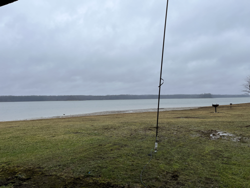 Chameleon vertical antenna deployed in front of the beach area of the reservoir at West Branch State Park.
