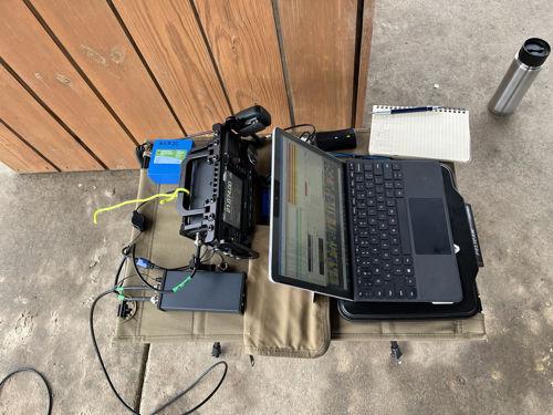 Portable table with IC-705, tuner, logbook, and MS Surface GO 2.