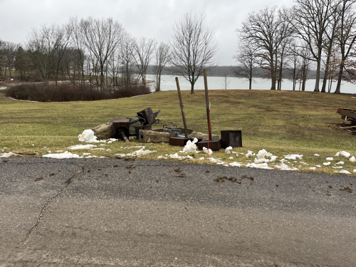 A pile of park grills and chunks of concrete.