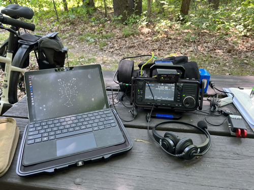 MS Surface Go 2, IC-705, Heil headset mic, and paddle on a picnic table.