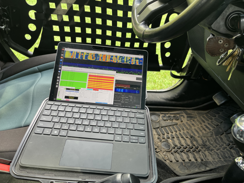 MS Surface Go 2 sitting on the driver's seat of the Jeep.
