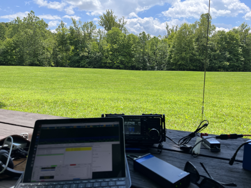 A view of the field near The Octogon at Cuyahoga Valley National Park from a picnic table covered in radio gear.