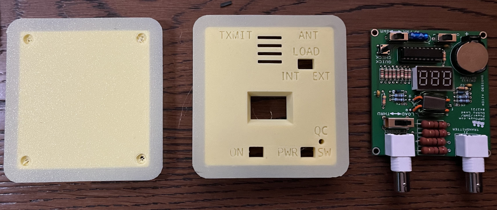 3d Printed case next to the assembled PCB.