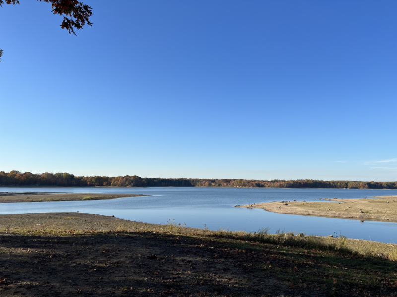 A reservoir under sunny conditions with a perfectly blue sky.