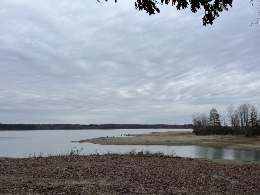 View of the reservoir at West Branch State Park with a cloudy sky overhead.