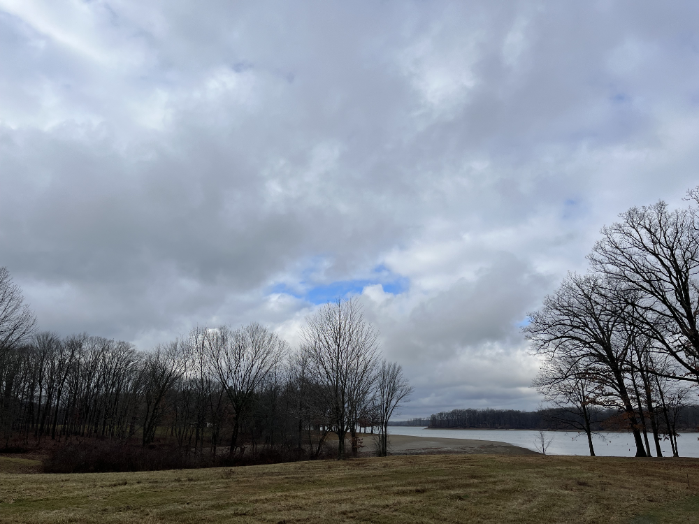 The sky taunting me with a single patch of blue within the dense clouds.