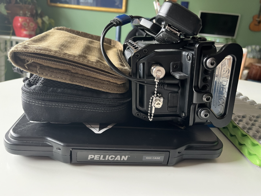 IC-705, Logbook, Tablet, and assorted radio gear in a pile.