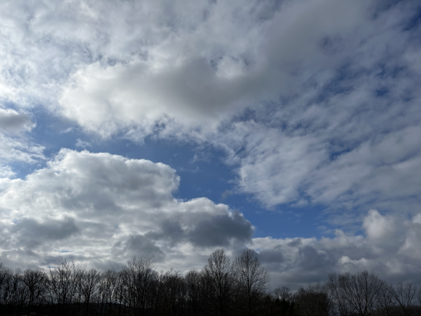 A cloudy sky with a touch of blue showing through.
