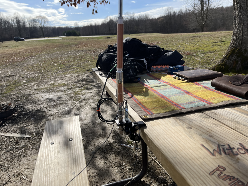 Clamp mount holding the AX1 on the picnic table.