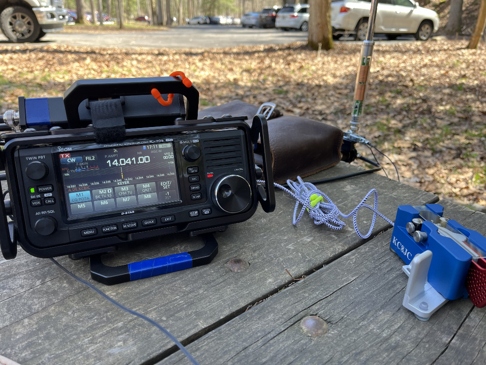 IC-705, Begalli Key, and AX1 antenna on a park bench.