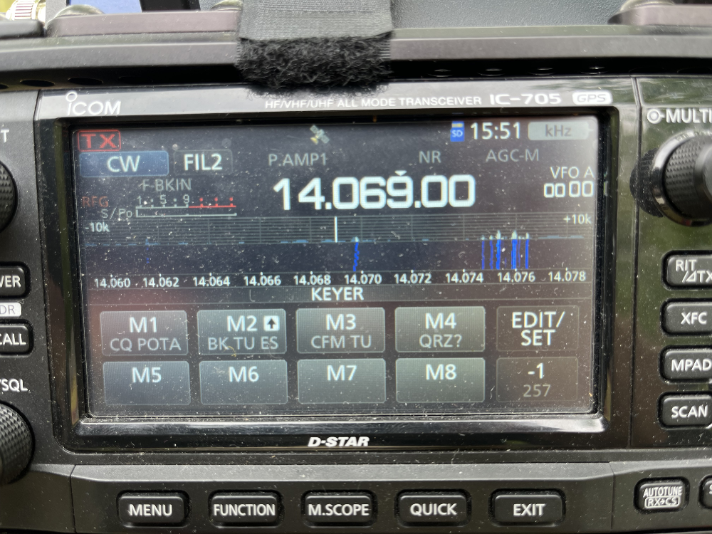 The disgustingly pollen-covered screen of the IC-705 showing FT8 traffic on the far right.