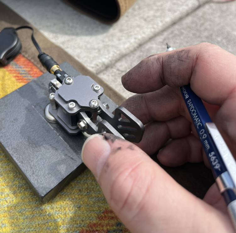 My greasy, bike-chain-fixing fingers working the Putikeeg paddles.