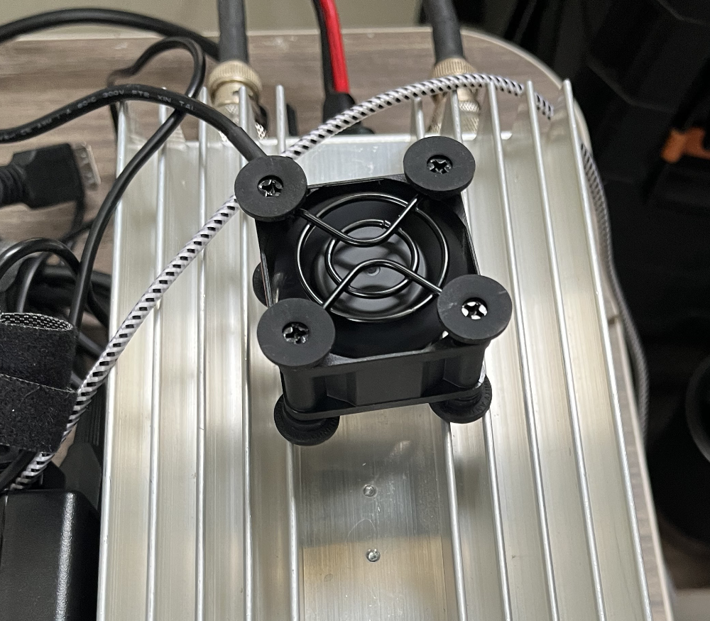 Hardrock-50 amplifier with a small USB powered fan sitting on top of it.