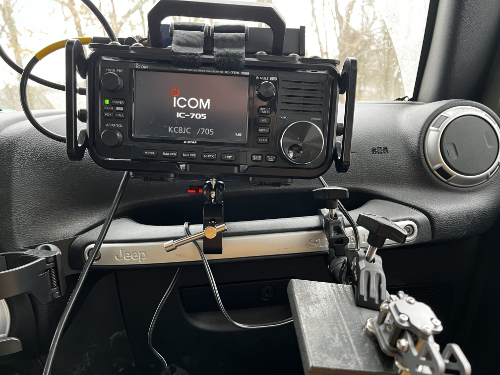 An IC-705 holding tight to the grab bar next to the set of paddles looking precarious but in reality it is quite stable.