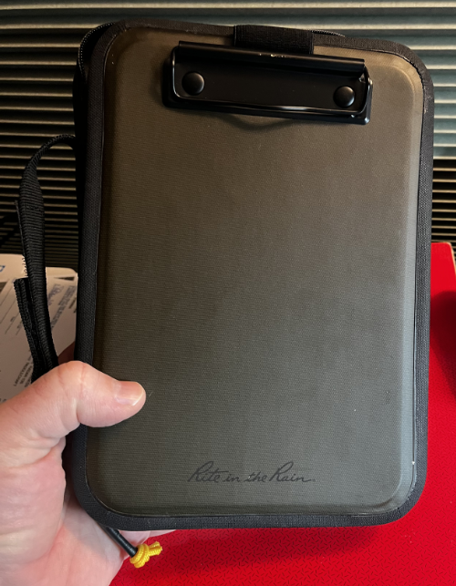 The Rite In The Rain hand desk closed to show the clipboard surface.